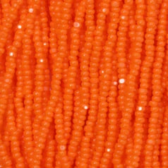 79O11134S Czech Seed Beads, 11 Charlotte – Opaque Orange (strung)