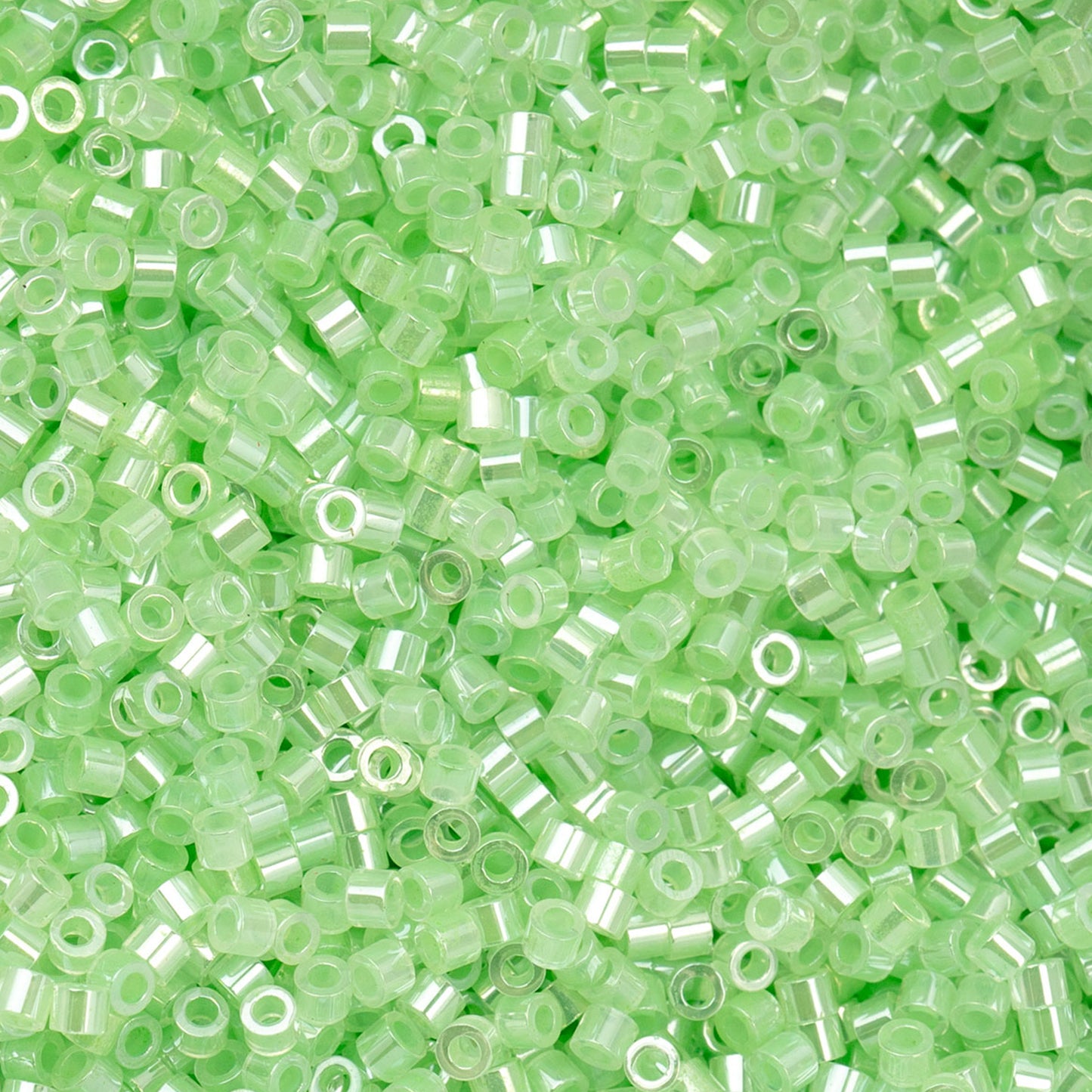 697cy11-1029 Cylin Bead sz 11 25g Bag Light Crystal Green Ceylon