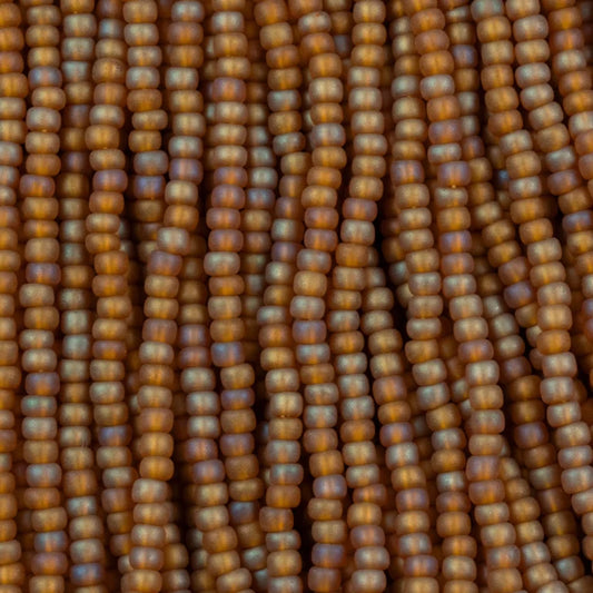 79-FTR-1105S Czech Seed Beads, sz 11 Transparent Matt Medium Topaz AB (strung)