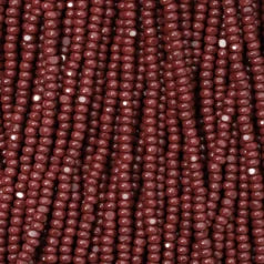 79O11138S Czech Seed Beads, 11 Charlotte – Opaque Dark Red (strung)
