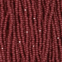 79O11139S Czech Seed Beads, 11, Charlotte – Opaque Dark Red Coral (strung)